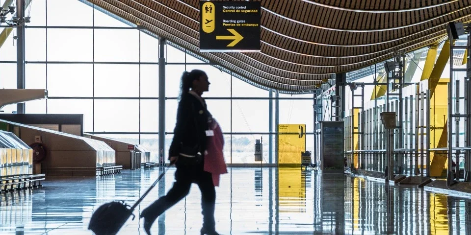 Lady walking through airport terminal