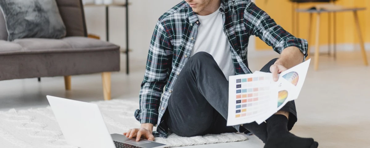 Man sitting on floor with his laptop