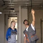 Pair of builders reviewing some work