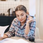 Woman sifting through paperwork