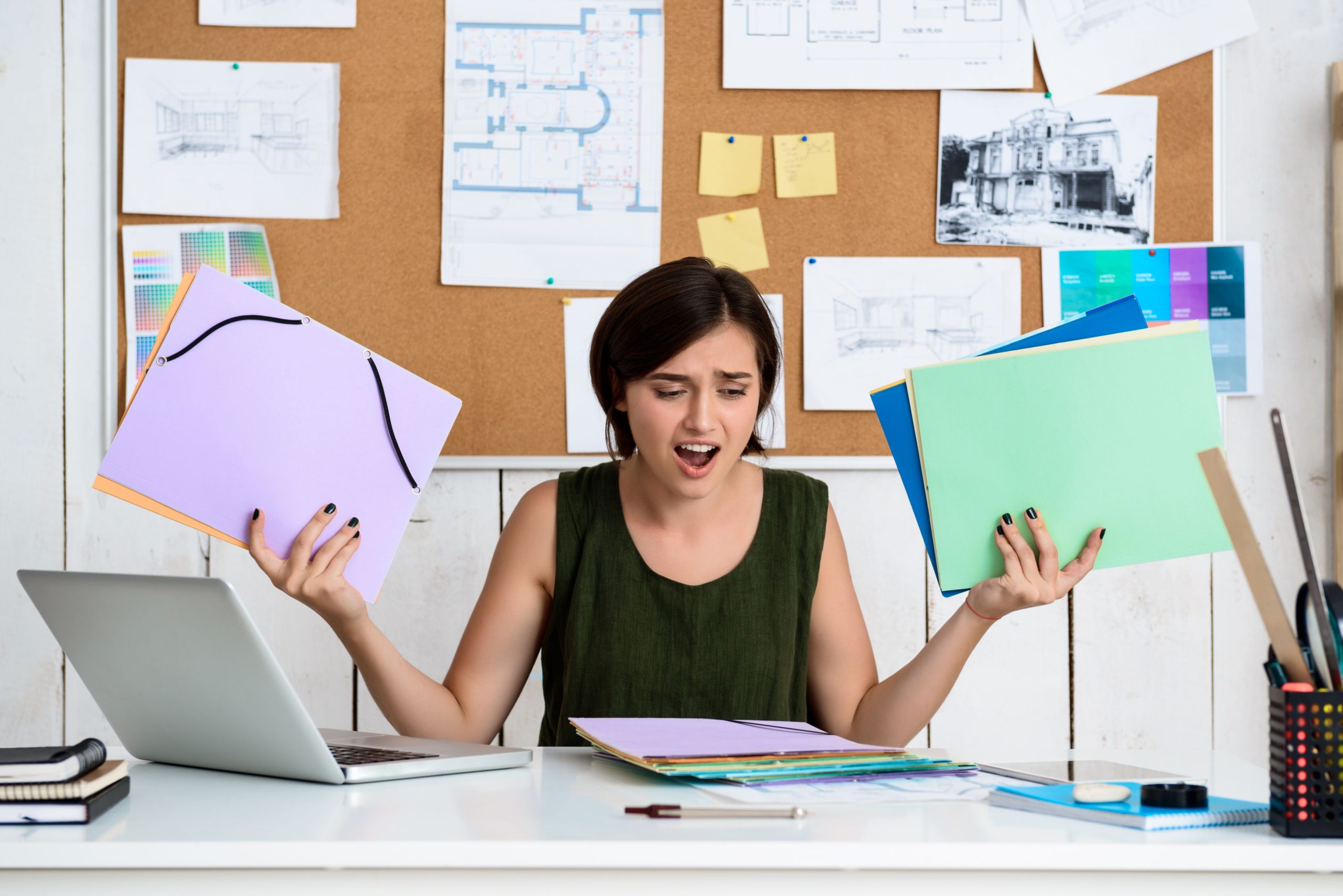 Woman stressing over paperwork.