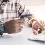 Man holding credit card for payment