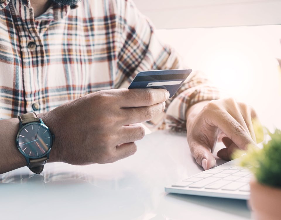 Man holding credit card for payment