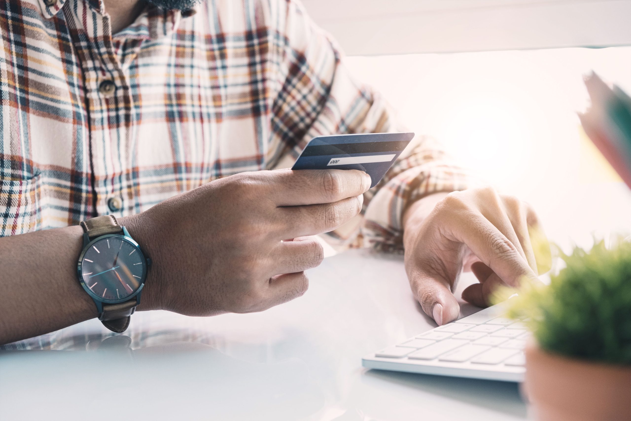 Man holding credit card for payment