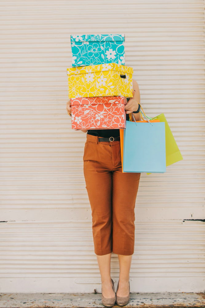 Woman holding boxes - Vinted tax